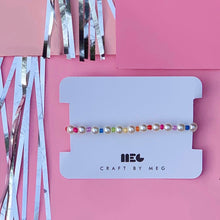 Load image into Gallery viewer, Customizable rainbow pearl stretch bracelet - made of immitation pearls and seed beads.  The bracelet length is customizable and each bracelet is handmade in Charlotte, NC.