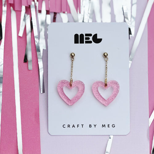 Acrylic translucent pink glitter open heart drop Earrings w/ Gold filled earring components; handmade in Charlotte, NC.